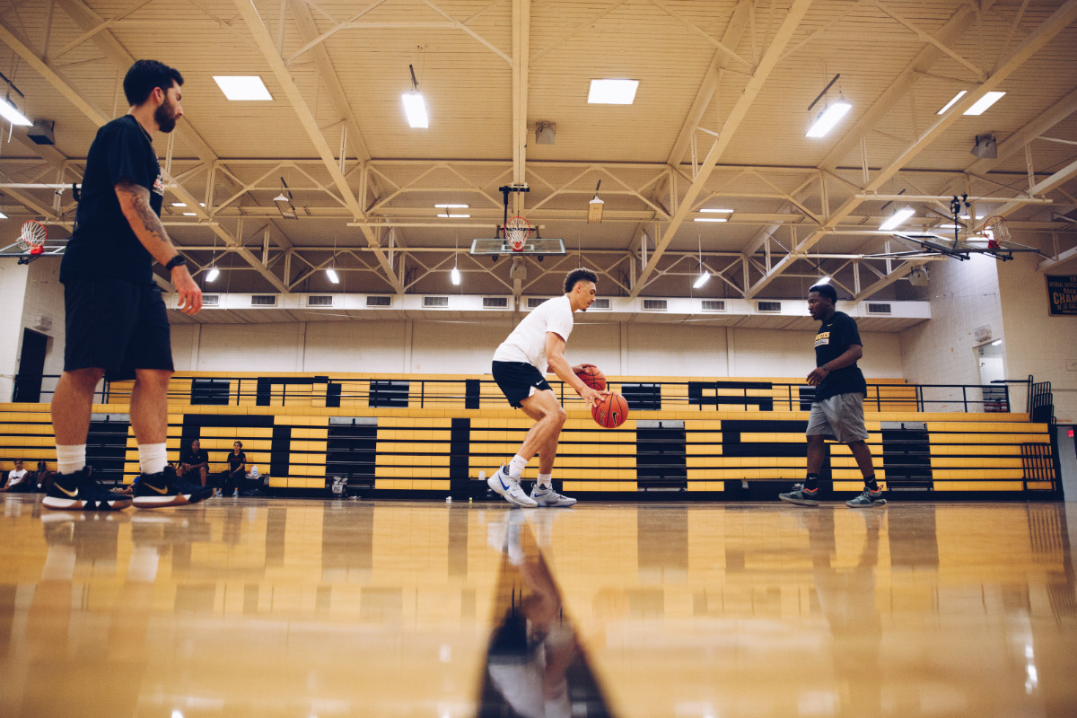 A photograph a professional basketball athlete completing dribbling drills